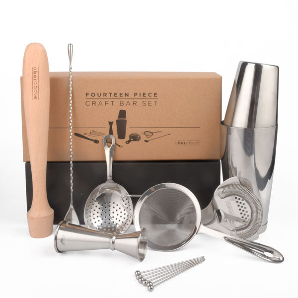 Abarabove brand product image of a fourteen-piece craft bar set featuring a stainless steel Boston shaker, wooden muddler, jigger, three types of strainers, and five cocktail picks, all displayed in front of its brown packaging box