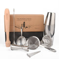 Abarabove brand product image of a fourteen-piece craft bar set featuring a stainless steel Boston shaker, wooden muddler, jigger, three types of strainers, and five cocktail picks, all displayed in front of its brown packaging box