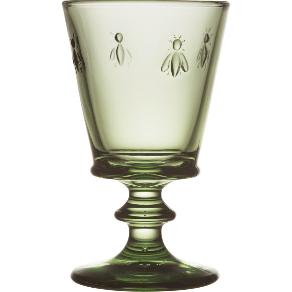 Green glassware goblet featuring charming embossed bee motifs and a distinctive sculpted fluted stem with visible trapped air bubbles in the base