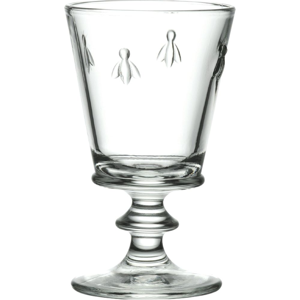 Glass clear stemmed drinking glass featuring embossed bee motifs and a distinctive baluster stem design