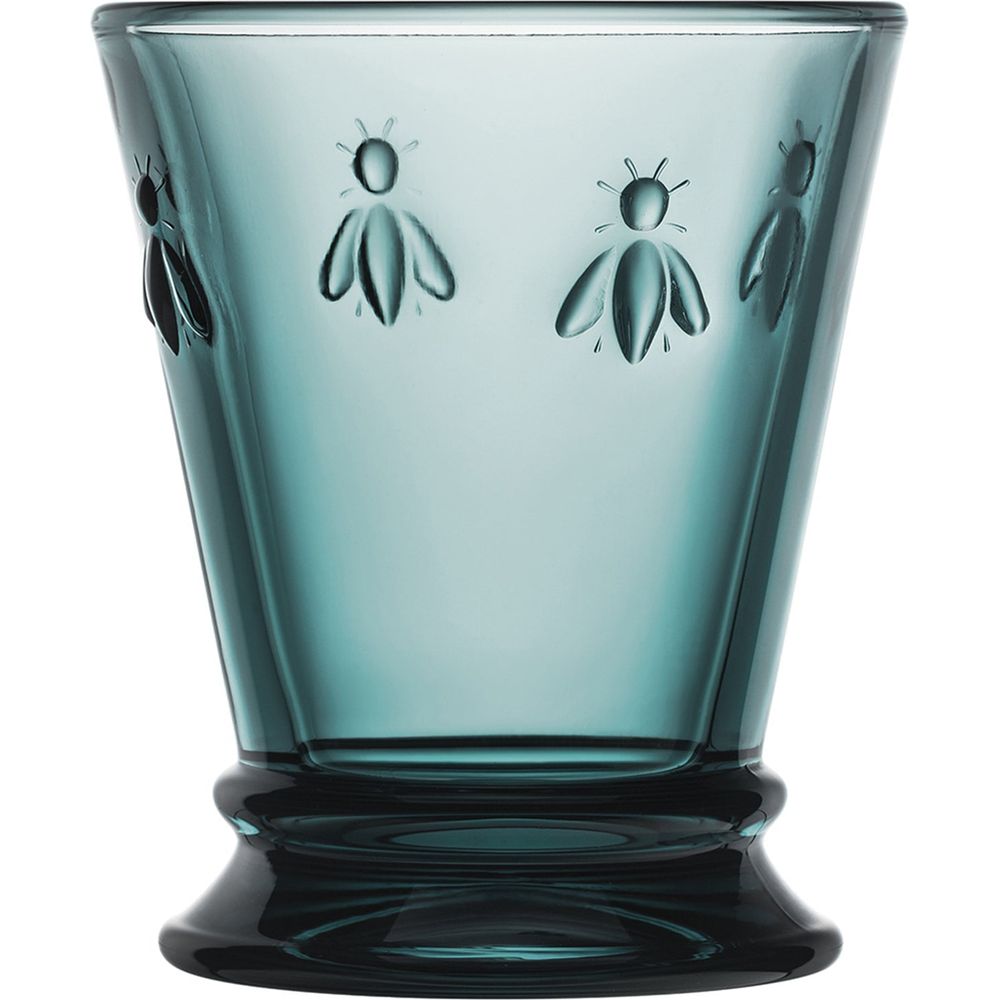 Teal glass drinking tumbler with embossed bee motifs and a flared pedestal base
