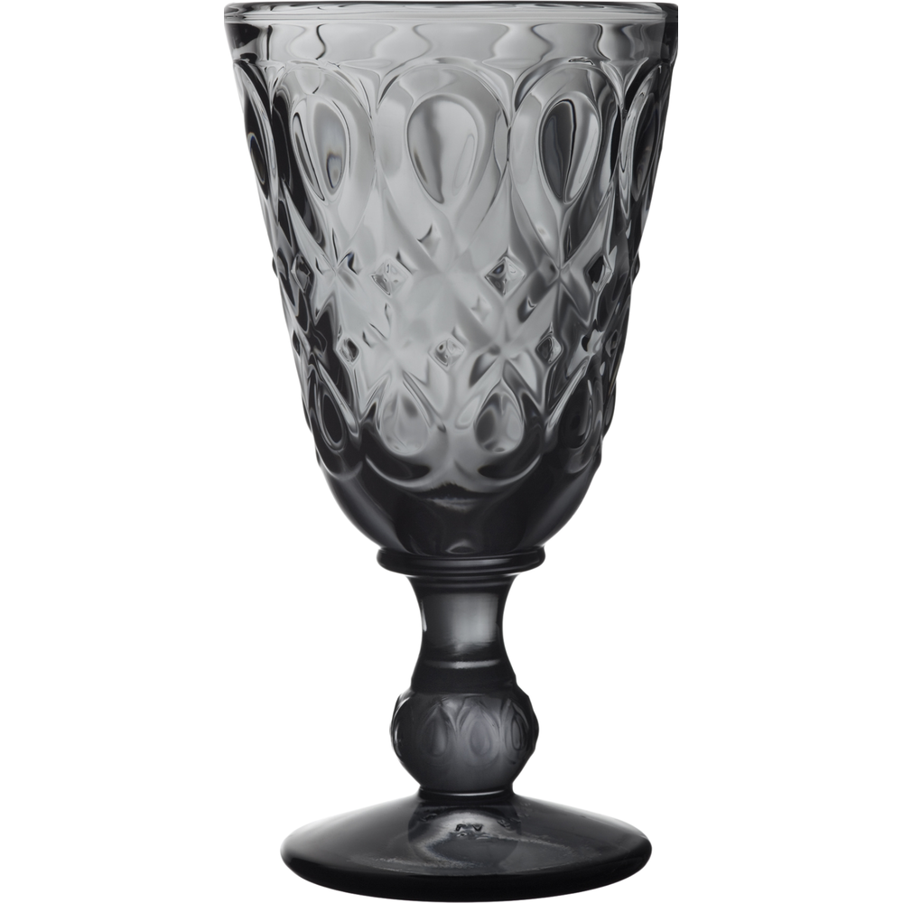 A dark grey glass goblet featuring intricate embossed diamond trellis and teardrop scale patterns with a textured stem on a white background