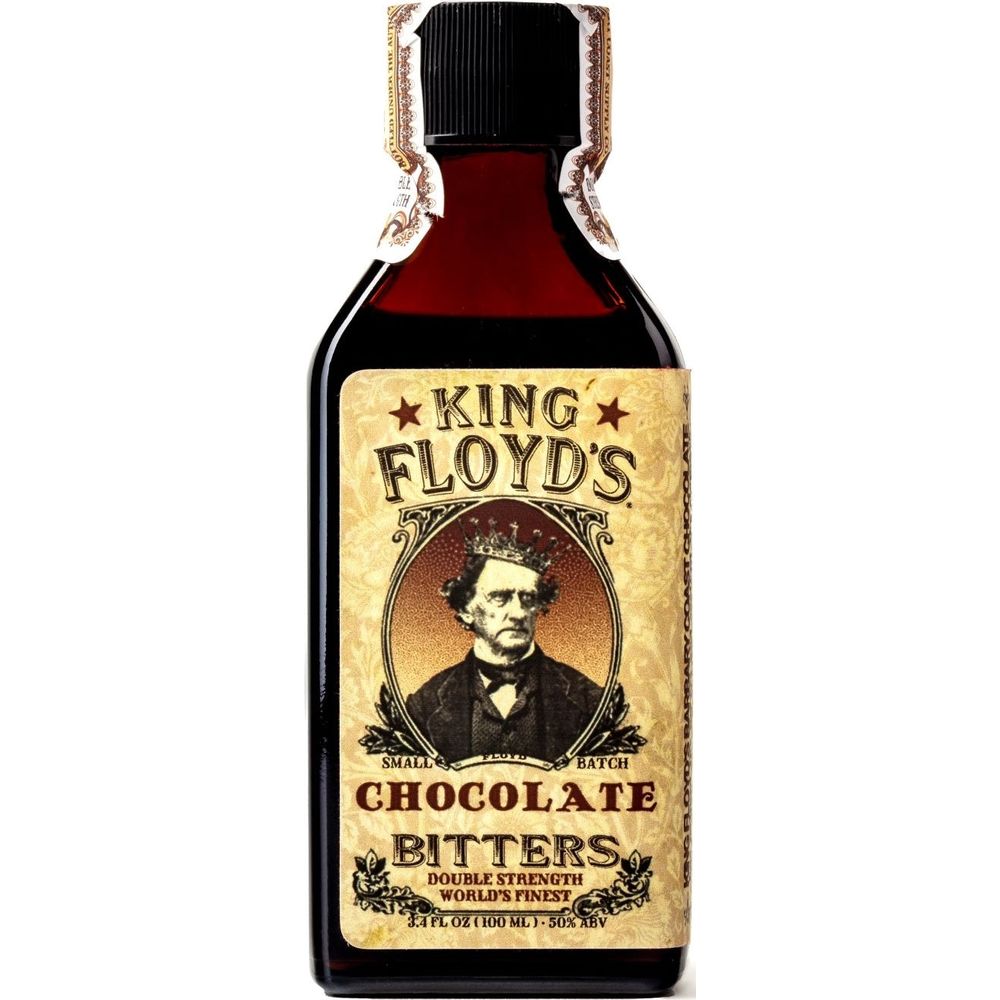 Product photography of a King Floyd's Chocolate Bitters bottle, a dark brown glass container with a vintage tan label depicting a man wearing a crown, accented by a decorative gold and red foil seal