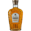 Product photograph of a full bottle of Crown Royal Hand Selected Barrel Canadian Whisky featuring its distinctive amber liquid and crown-shaped embossed glass design topped with a gold cap and a white label detailing 51.5% alcohol by volume