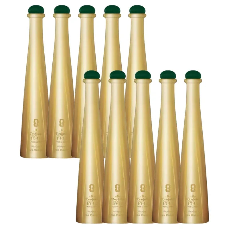 Nine gold tapered Don Julio 1942 Tequila bottles with dark green caps displayed against a clean white background