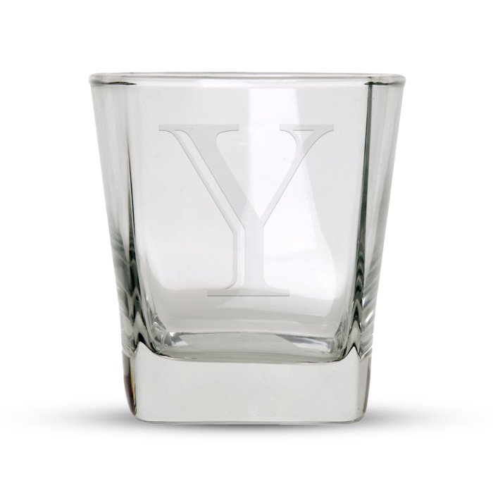 Clear glass tumbler with an etched capital letter Y and a thick square base