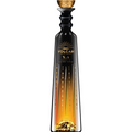 Volcan de mi Tierra X.A. Tequila Extra Aged bottle featuring a sleek black sculptural design, a prominent golden sunburst logo, elegant ascending golden flame patterns, and a shimmering golden volcanic landscape at its base topped with a textured gold stopper