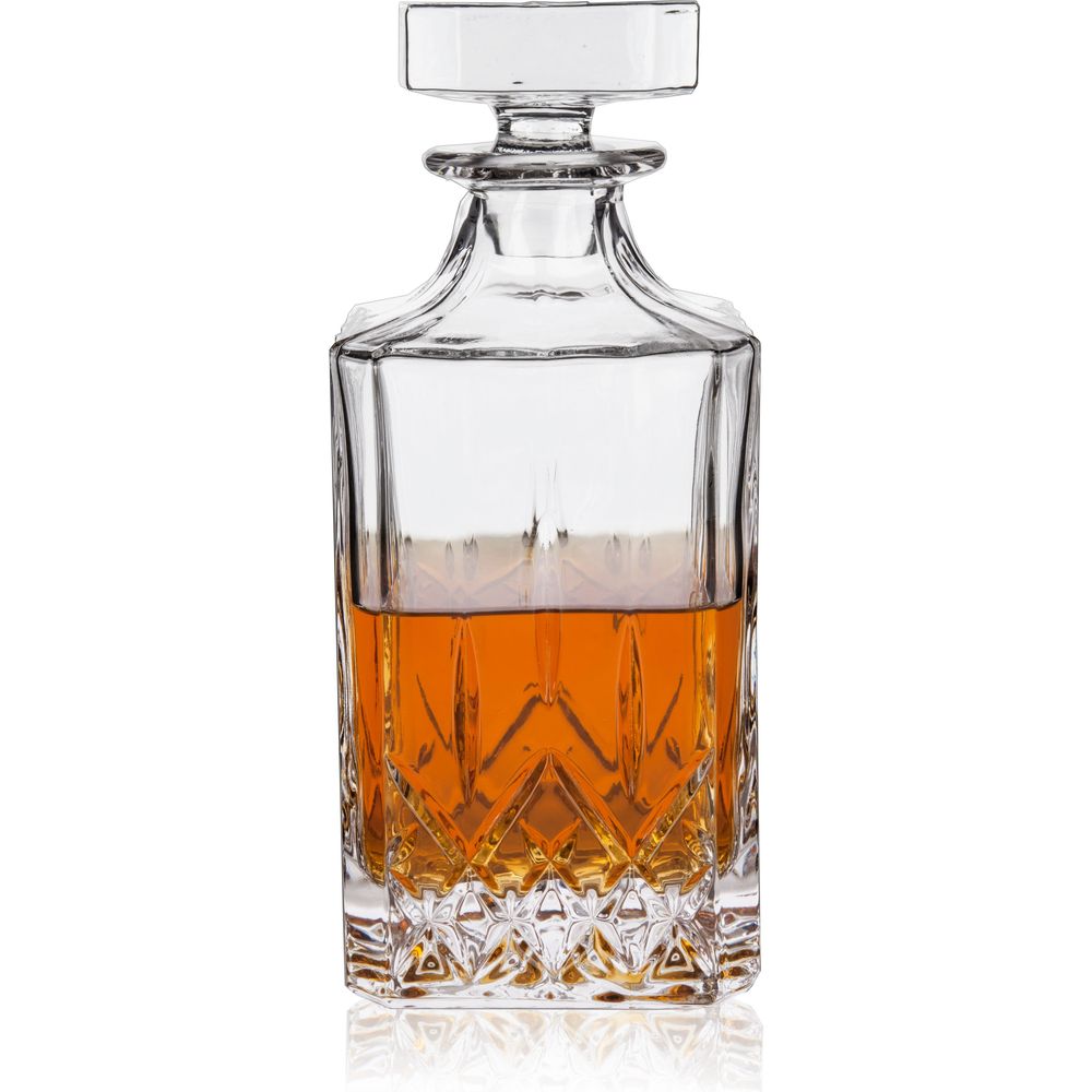 Clear glass decanter filled with amber liquid featuring a faceted square stopper and an intricate diamond-cut pattern on its lower half