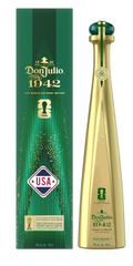 Product photography of a Don Julio 1942 Tequila FIFA World Cup 2026 Edition featuring a tall golden bottle with a dark green faceted cap next to its matching dark green box adorned with shimmering gold vertical accents, a prominent USA flag logo, and the FIFA World Cup trophy icon