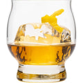 A glass of amber whiskey with a large melting ice cube and a bright yellow lemon peel twist isolated on a white background