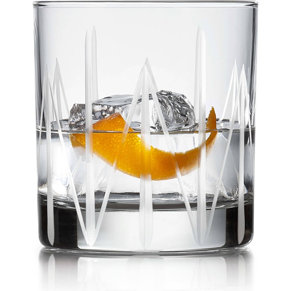 A transparent glass containing clear liquid, ice cubes, and a bright orange peel, adorned with a frosted white geometric vertical line pattern