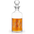 Clear glass decanter with a spherical stopper filled with amber liquid adorned with a black and white Art Deco fan pattern
