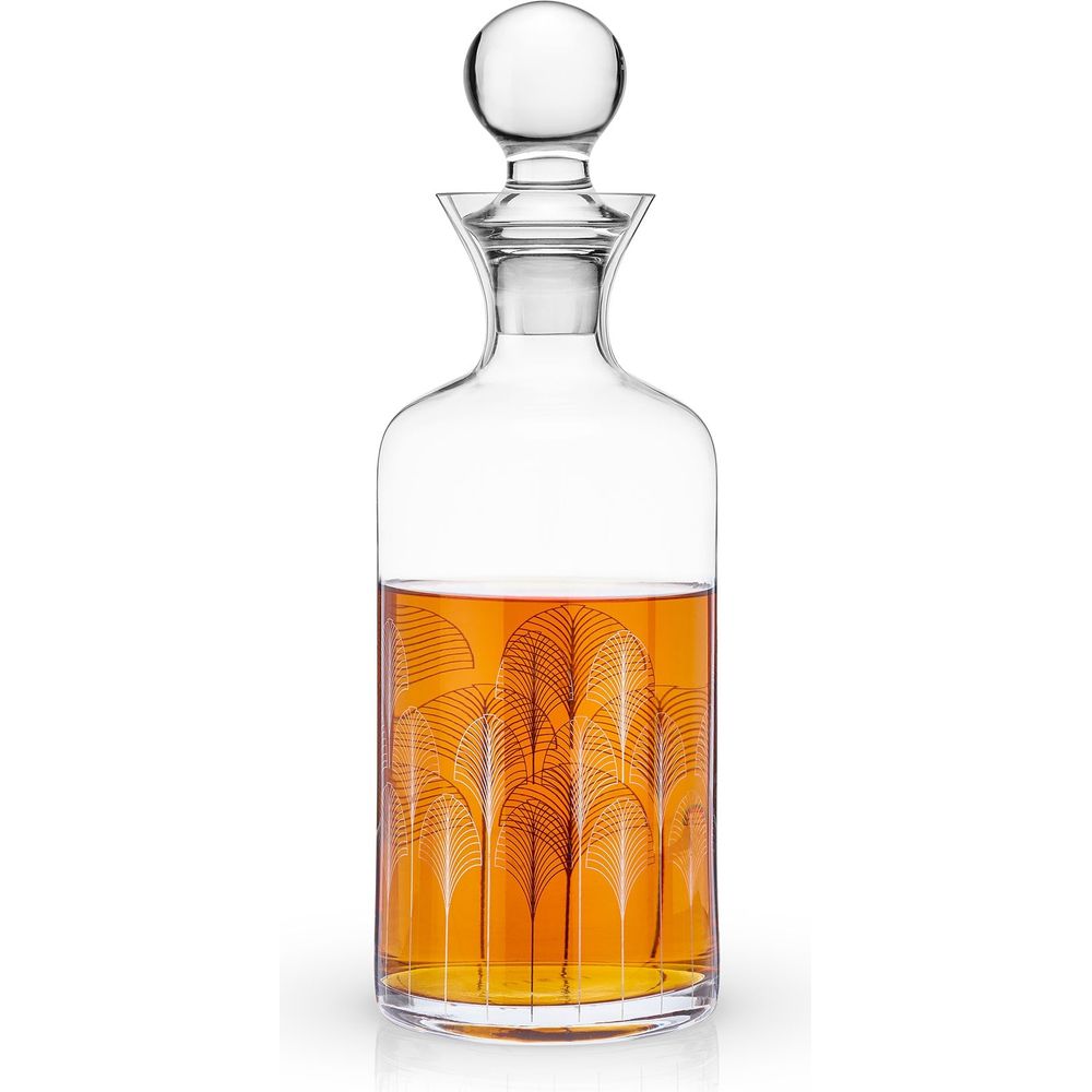 Clear glass decanter with a spherical stopper filled with amber liquid adorned with a black and white Art Deco fan pattern