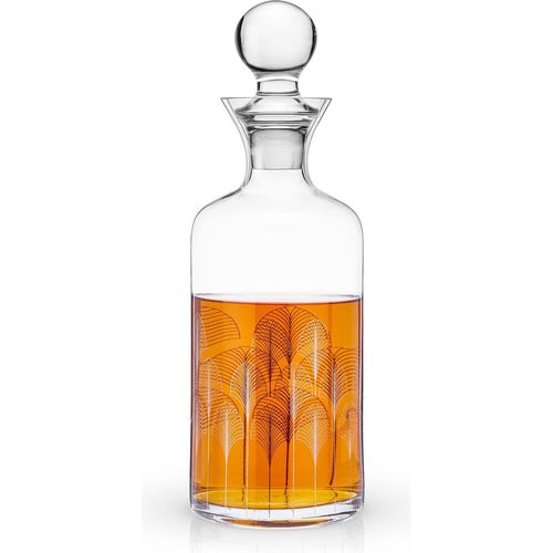 Clear glass decanter with a spherical stopper filled with amber liquid adorned with a black and white Art Deco fan pattern